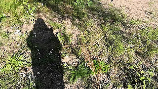 Naked man is surprised while peeing in nature and gets a helping hand