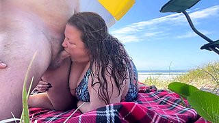 Fat wife blows on the beach