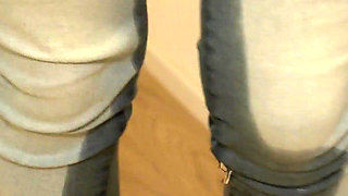 Desperately Wetting Jeans in Front of Busy Bathroom