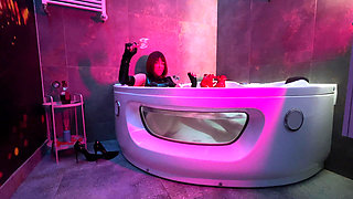 Mistress' Taking a Bath in Latex and Boots