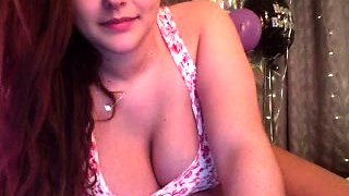 Busty babe playing with her big boobs