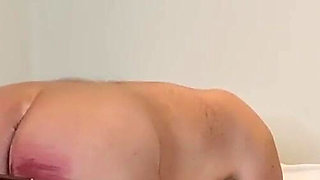 Young domme canes her slave