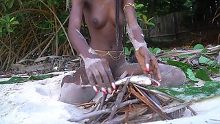 African harlot plays with fire naked