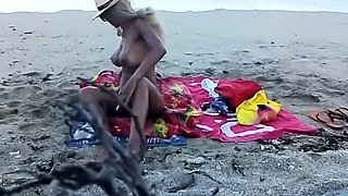 My stepdaughter teases me on the beach