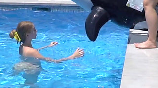 Lesbian Girls Are Having Fun in a Pool with an Inflatable Shark