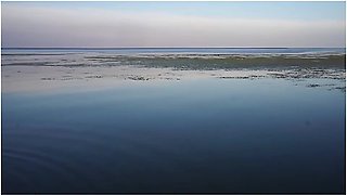 Unstripping On Beach Of Volga-river
