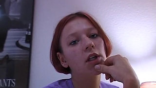 Redhead girl rubs and fingers her wet twat