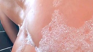 Amateur bikini clad babe oils up her big ass outdoors