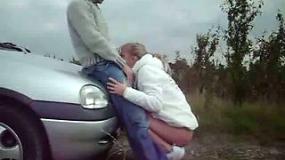 Kinky couple having sex outdoors near the car