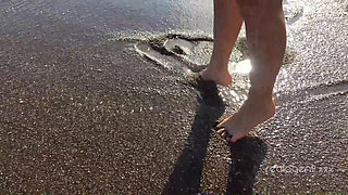 Alone lush Russian babe toys her cunt on the rock on the sea shore