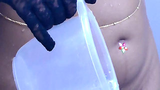 Young girl stripping and taking bath