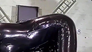 Latex Nurse inspects her gimp patient