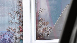 Naked in public. Taxi driver watches from car as woman in robe without panties and bra in stockings washes an apartment window