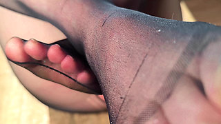 Slapping her cunt with nylons on