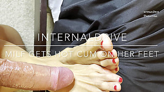 Milf gets hot cum on her feet and licks it off.