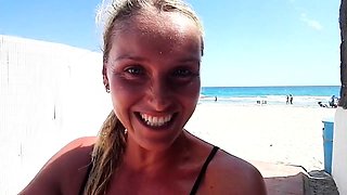 Outdoor solo masturbation scene with curly blonde